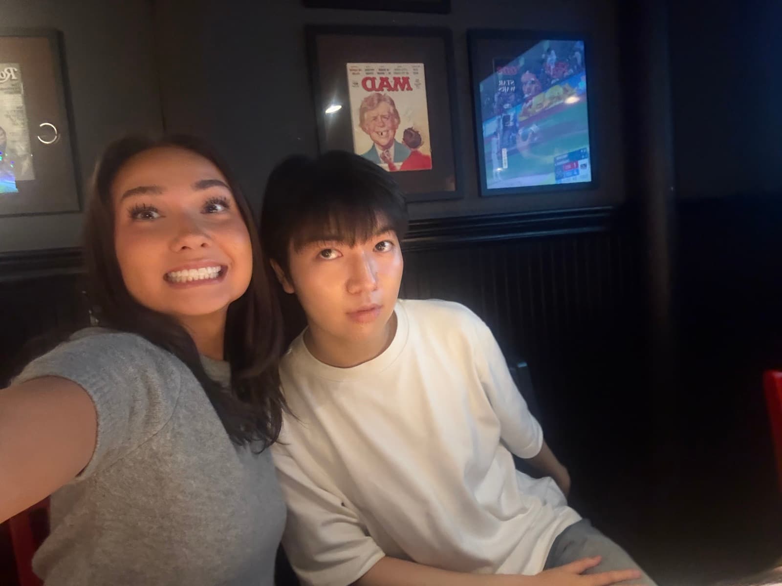 Lucas and a friend in a dorm room