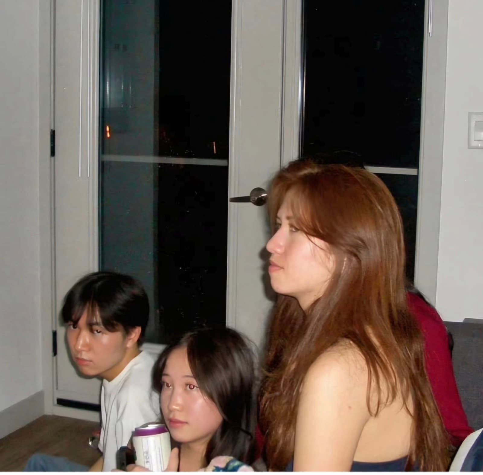 Lucas with friends by a window