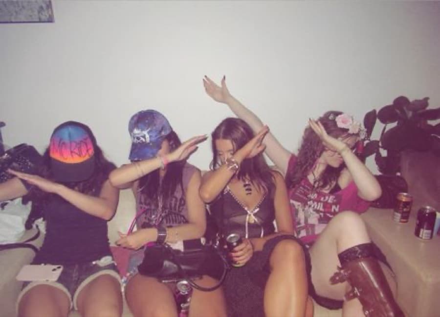 Friends dabbing at a party